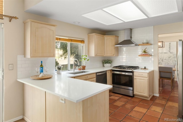 5649 W 109th Cir, Westminster, CO 80020 - kitchen with light brown cabinets, wall chimney exhaust hood, stainless steel appliances, backsplash, and a peninsula