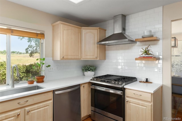 5649 W 109th Cir, Westminster, CO 80020 - kitchen with light brown cabinets, wall chimney exhaust hood, appliances with stainless steel finishes, and decorative backsplash