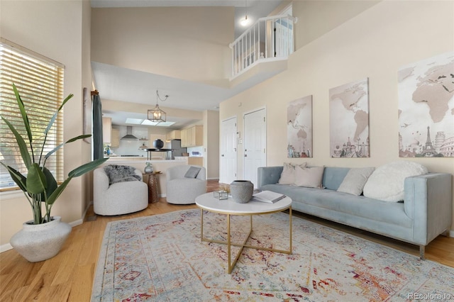 5649 W 109th Cir, Westminster, CO 80020 - living room featuring light wood finished floors and a high ceiling