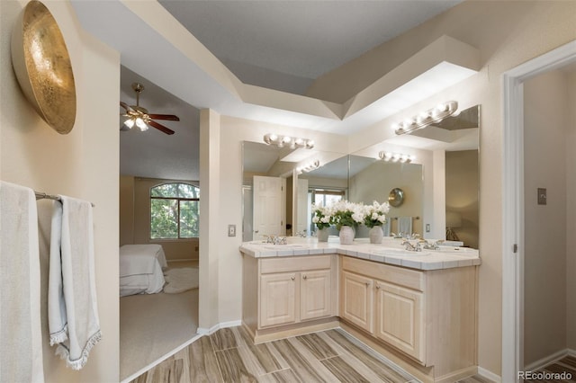 5649 W 109th Cir, Westminster, CO 80020 - ensuite bathroom with double vanity, wood finished floors, and ceiling fan