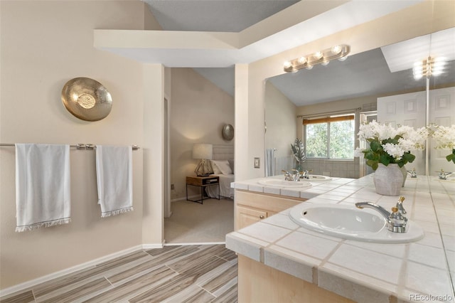 5649 W 109th Cir, Westminster, CO 80020 - bathroom featuring double vanity and wood finished floors