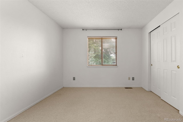 5649 W 109th Cir, Westminster, CO 80020 - unfurnished bedroom with light carpet, a textured ceiling, and a closet