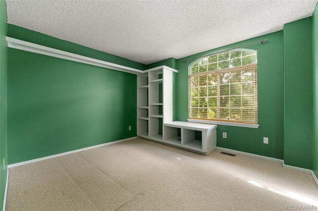 5649 W 109th Cir, Westminster, CO 80020 - unfurnished living room with a textured ceiling and carpet