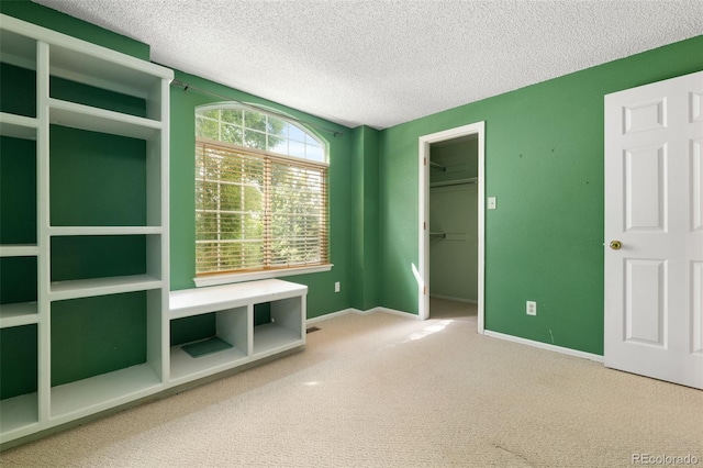5649 W 109th Cir, Westminster, CO 80020 - unfurnished bedroom with carpet flooring, a textured ceiling, a spacious closet, and a closet