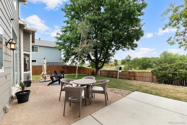 5649 W 109th Cir, Westminster, CO 80020 - fenced backyard with outdoor dining area and a patio