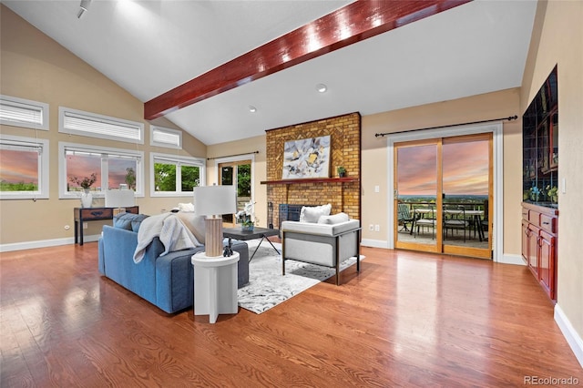 7883 S Espana Way, Centennial, CO 80016 - living room with wood finished floors, a fireplace, and baseboards
