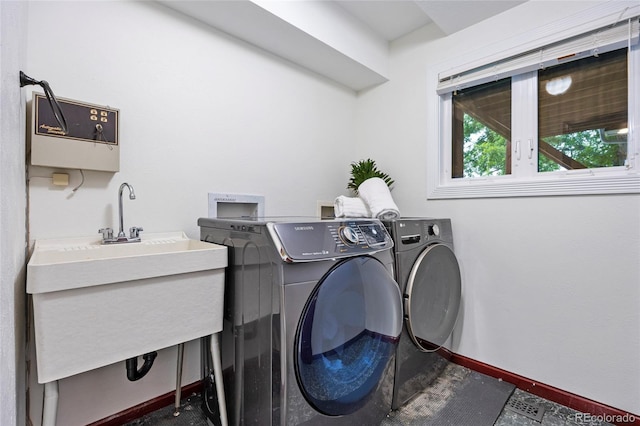 7883 S Espana Way, Centennial, CO 80016 - washroom with washing machine and clothes dryer and baseboards