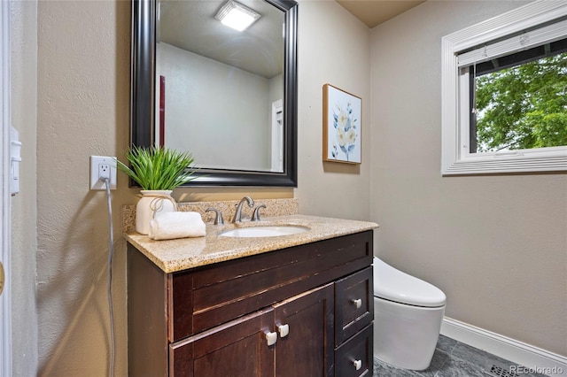 7883 S Espana Way, Centennial, CO 80016 - bathroom with toilet, vanity, and baseboards