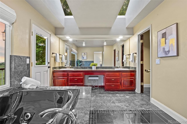 7883 S Espana Way, Centennial, CO 80016 - bathroom featuring double vanity, baseboards, and marble finish floors