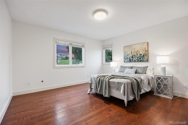 7883 S Espana Way, Centennial, CO 80016 - bedroom featuring dark wood-style floors and baseboards