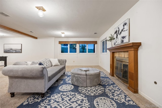 7883 S Espana Way, Centennial, CO 80016 - living area featuring carpet flooring, a tile fireplace, and baseboards