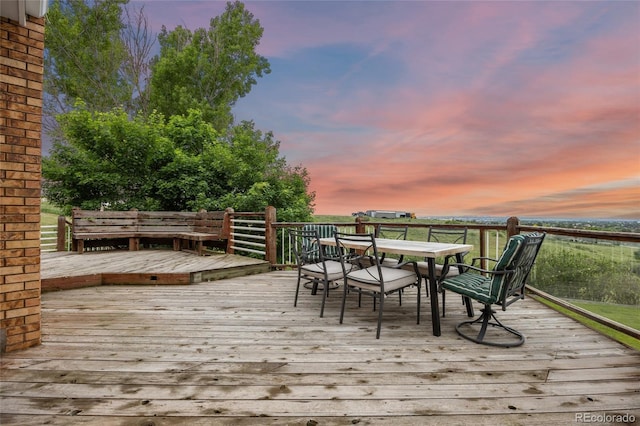 7883 S Espana Way, Centennial, CO 80016 - deck at dusk featuring outdoor dining space