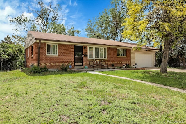 8660 De Soto St, Denver, CO 80229 - single story home with brick siding, a garage, and concrete driveway