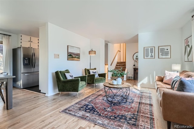 living room with light hardwood / wood-style flooring