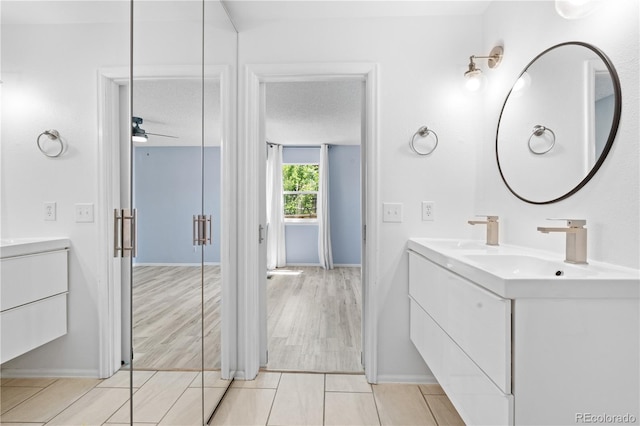 381 Mountain Cloud Cir, Highlands Ranch, CO 80126 - bathroom with double vanity, ceiling fan, and baseboards