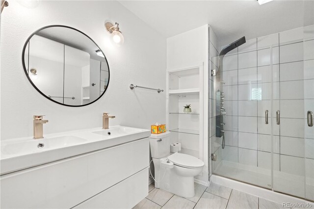 381 Mountain Cloud Cir, Highlands Ranch, CO 80126 - bathroom with toilet, double vanity, a shower stall, and tile patterned flooring