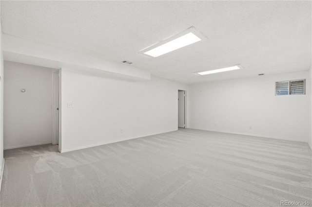381 Mountain Cloud Cir, Highlands Ranch, CO 80126 - empty room featuring light carpet, a textured ceiling, and baseboards