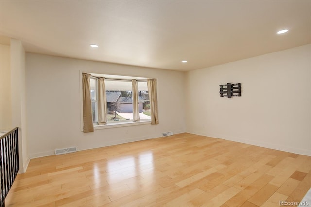 3785 S Benton Way, Denver, CO 80235 - empty room with wood finished floors and recessed lighting