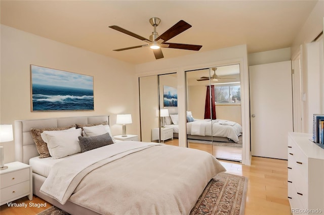 3785 S Benton Way, Denver, CO 80235 - bedroom featuring multiple closets, light wood finished floors, and a ceiling fan