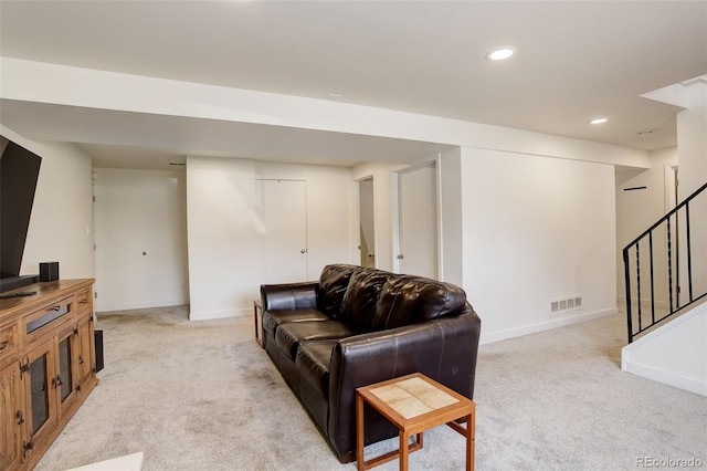 3785 S Benton Way, Denver, CO 80235 - living room featuring light colored carpet, stairway, and recessed lighting