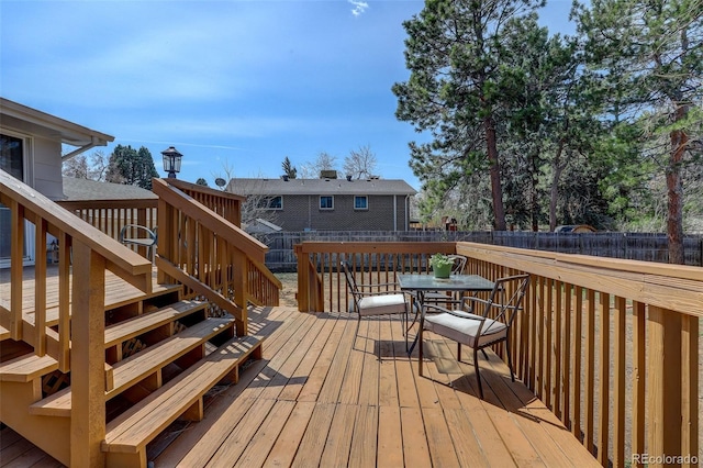 3785 S Benton Way, Denver, CO 80235 - wooden terrace with a fenced backyard, stairs, and outdoor dining area