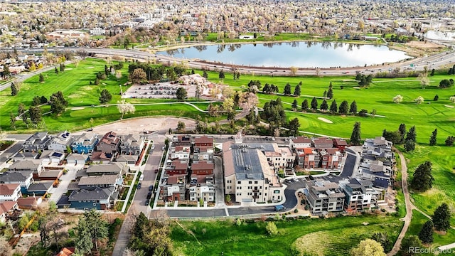 drone / aerial view featuring a water view and a residential view