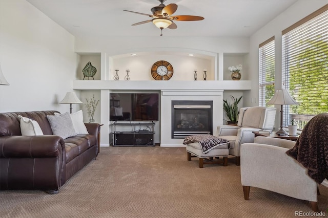 10448 Kicking Horse Dr, Littleton, CO 80125 - living room with carpet, ceiling fan, and a glass covered fireplace
