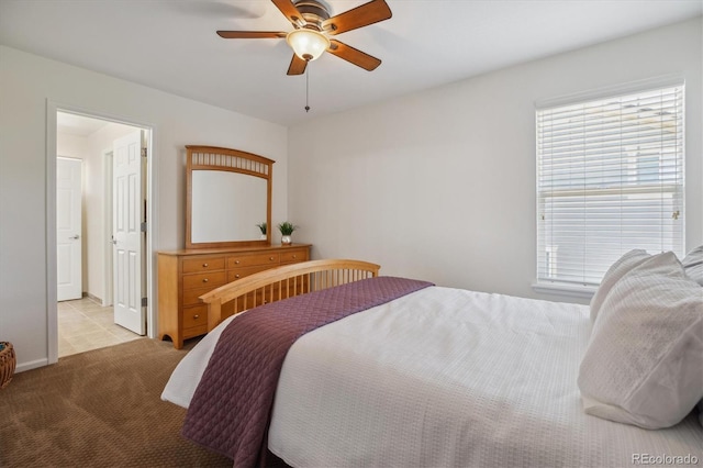 10448 Kicking Horse Dr, Littleton, CO 80125 - bedroom with light colored carpet and a ceiling fan