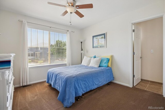 10448 Kicking Horse Dr, Littleton, CO 80125 - bedroom featuring baseboards, a ceiling fan, and carpet floors