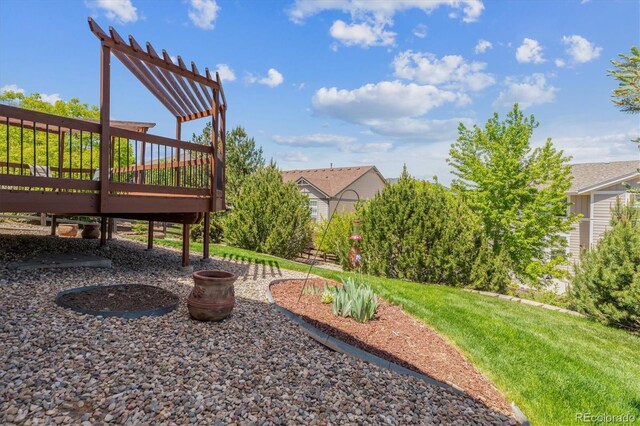 10448 Kicking Horse Dr, Littleton, CO 80125 - view of green lawn with a deck and a pergola