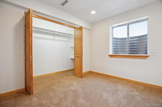 10448 Kicking Horse Dr, Littleton, CO 80125 - unfurnished bedroom featuring light colored carpet, baseboards, a closet, and recessed lighting