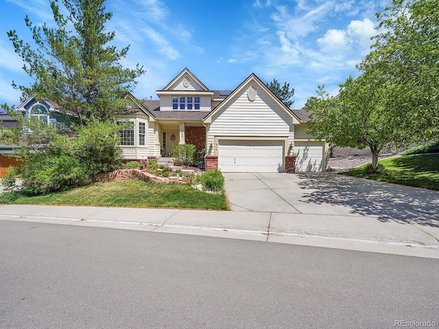 848 Huntington Pl, Highlands Ranch, CO 80126 - view of front of house with brick siding, an attached garage, concrete driveway, roof mounted solar panels, and a front lawn