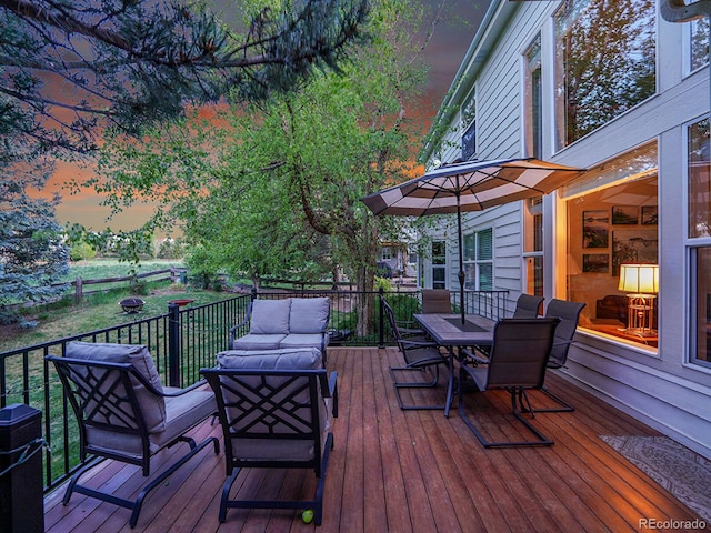 848 Huntington Pl, Highlands Ranch, CO 80126 - deck at dusk featuring outdoor dining space and outdoor lounge area