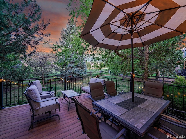 848 Huntington Pl, Highlands Ranch, CO 80126 - deck at dusk with outdoor dining area and a fenced backyard