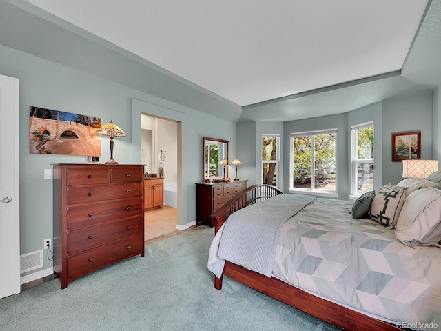 848 Huntington Pl, Highlands Ranch, CO 80126 - bedroom featuring light colored carpet, connected bathroom, and baseboards