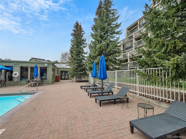 0125 W Keystone Rd Unit 209, Keystone, CO 80435 - fenced backyard featuring a patio area and a community pool