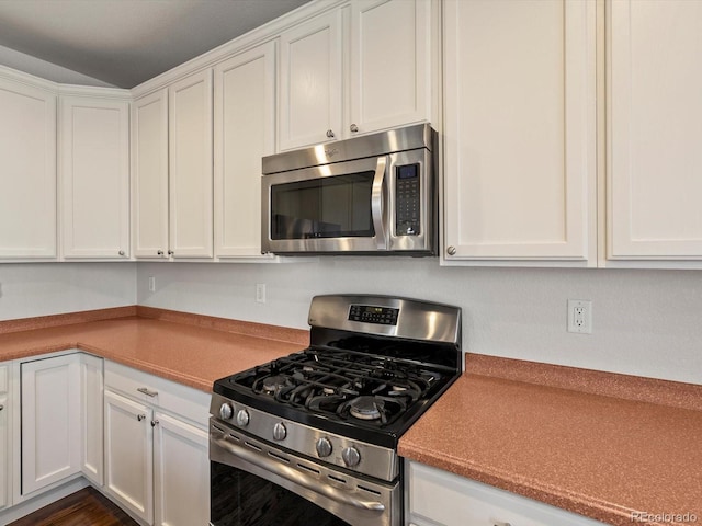 kitchen featuring light countertops, white cabinetry, and stainless steel appliances