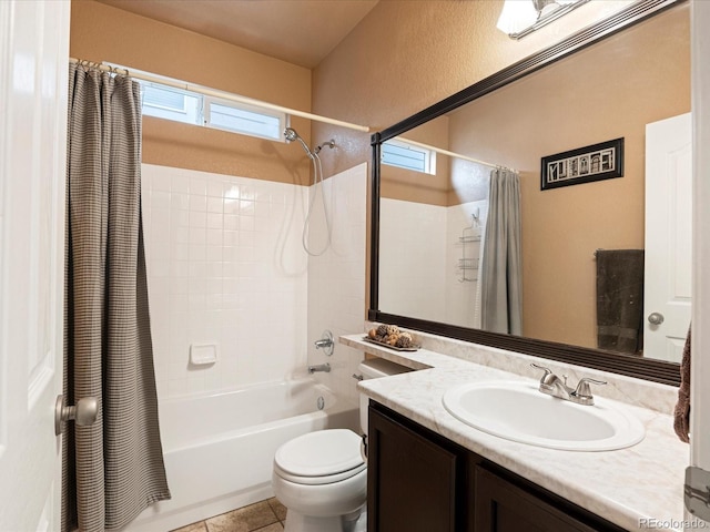 bathroom featuring toilet, shower / tub combo, vanity, and tile patterned floors