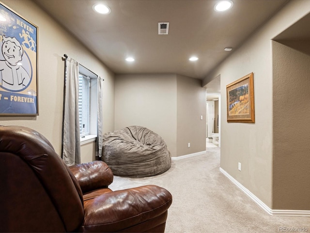 living area featuring visible vents, baseboards, carpet, and recessed lighting