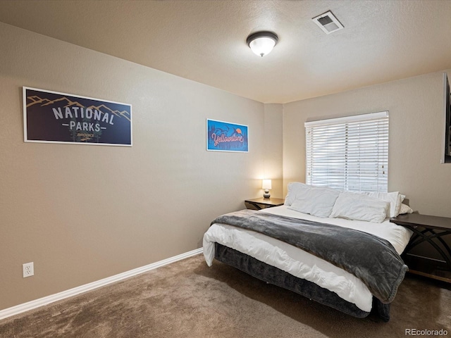bedroom with visible vents, baseboards, and carpet flooring
