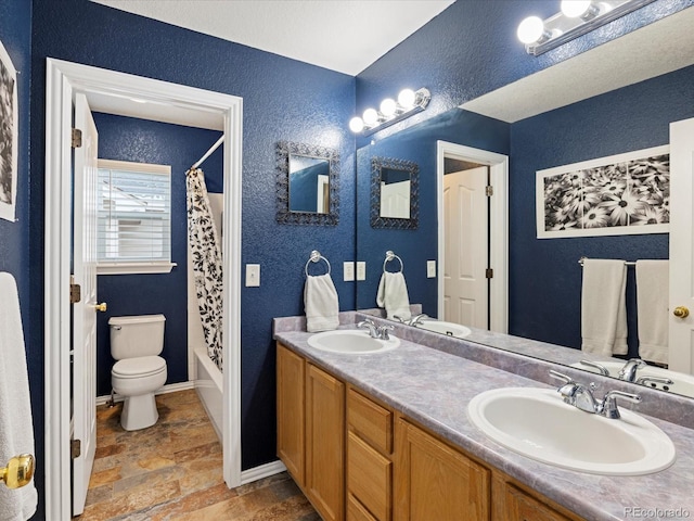 bathroom with a textured wall, shower / tub combo, and a sink