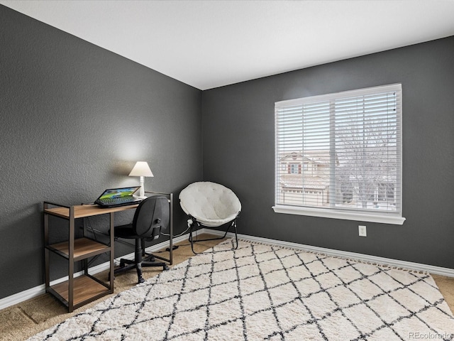office space featuring plenty of natural light and baseboards