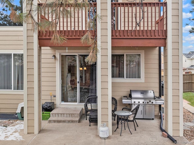 view of patio featuring grilling area and fence
