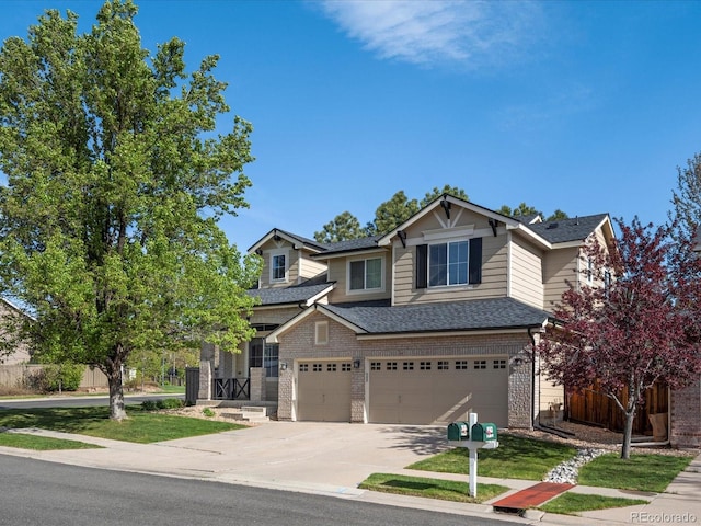 craftsman house with an attached garage, a shingled roof, driveway, and fence