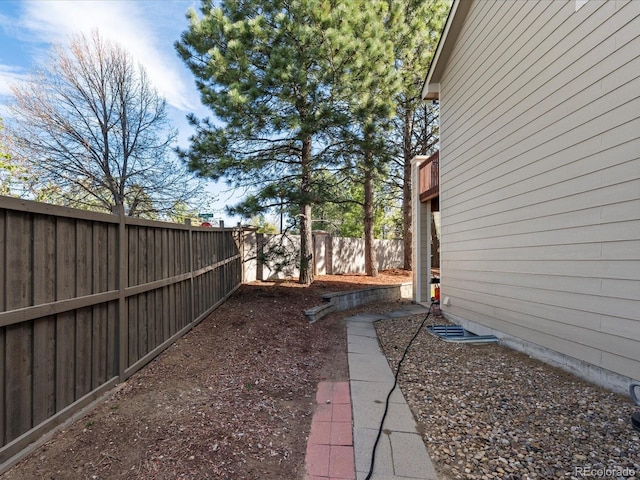 view of yard featuring a fenced backyard