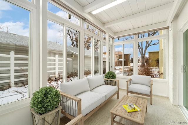 sunroom with beam ceiling