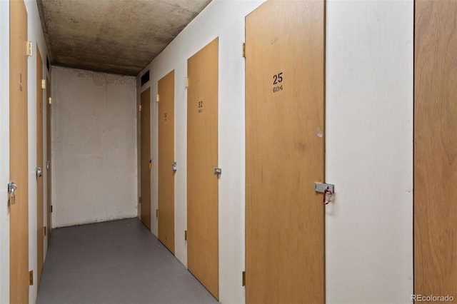 hall with concrete floors