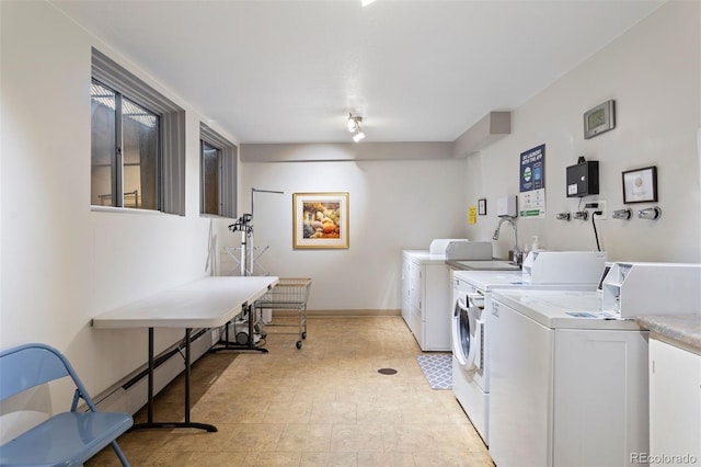 washroom featuring washer and clothes dryer