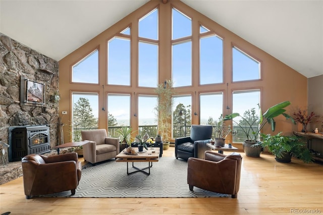 13452 Riley Peak Rd, Conifer, CO 80433 - living room with high vaulted ceiling, hardwood / wood-style floors, and healthy amount of natural light
