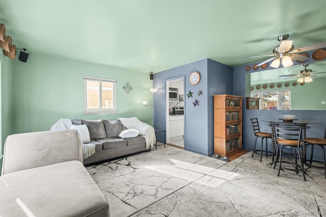 living room with ceiling fan